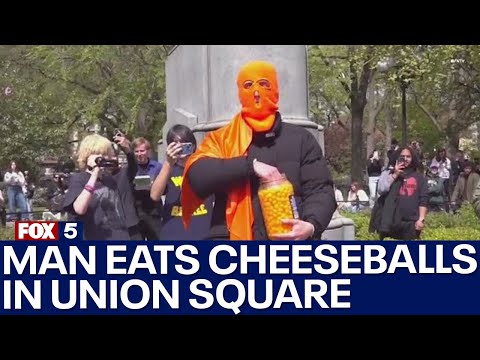 Hundreds turn out to watch man eat cheeseballs [Video]