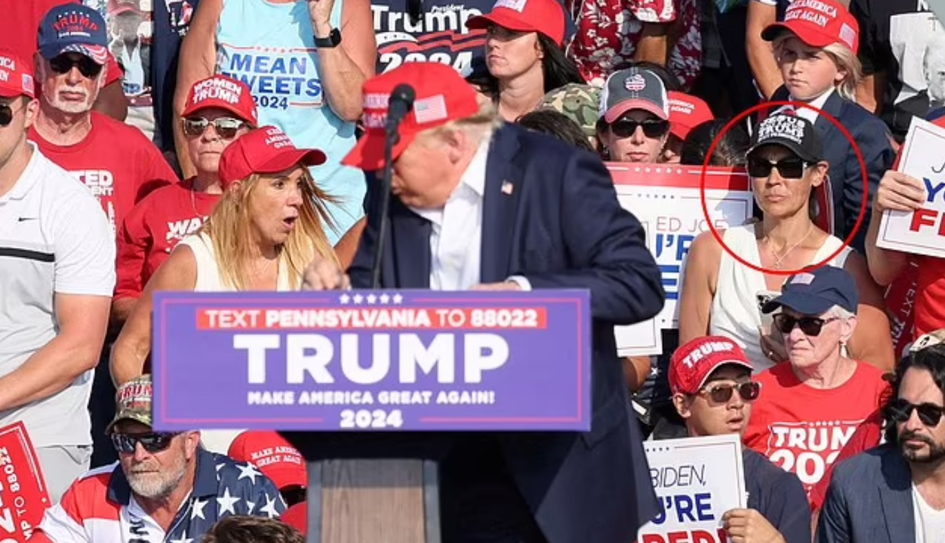 Mystery Woman Sitting Behind Trump During Assassination Attempt Fuels Bizarre Conspiracy Theories for Her Strange Reaction [WATCH] [Video]